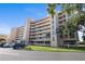 Condo building exterior with balconies, landscaping, parking and prominent signage is featured at 4410 Fairways Blvd # 104, Bradenton, FL 34209