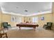 The game room features a billiard table and comfortable chairs for hours of entertainment at 4410 Fairways Blvd # 104, Bradenton, FL 34209