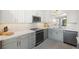 Contemporary kitchen featuring sleek countertops, tile backsplash, and modern appliances at 4410 Fairways Blvd # 104, Bradenton, FL 34209