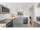 Well-appointed kitchen featuring updated appliances, tile backsplash and neutral color scheme at 4410 Fairways Blvd # 104, Bradenton, FL 34209