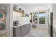 Updated kitchen featuring stainless steel appliances, tile backsplash and gray and white cabinets at 4410 Fairways Blvd # 104, Bradenton, FL 34209