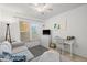 Bright living room with a neutral color scheme, ceiling fan, and comfortable seating area at 4410 Fairways Blvd # 104, Bradenton, FL 34209