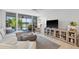 Comfortable living room with balcony access and natural light at 4410 Fairways Blvd # 104, Bradenton, FL 34209