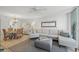 Open concept living room and dining area with natural lighting at 4410 Fairways Blvd # 104, Bradenton, FL 34209