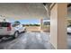 The covered parking features designated parking spots and views of the landscaped exterior at 4410 Fairways Blvd # 104, Bradenton, FL 34209