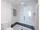 Contemporary bathroom shower with frameless glass enclosure, sleek fixtures, and modern tile work for a clean design at 4410 Fairways Blvd # 104, Bradenton, FL 34209