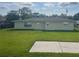 Expansive backyard featuring lush green grass and a concrete patio, perfect for outdoor entertaining at 48 Dade Ave, Sarasota, FL 34232