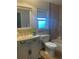 Bathroom with an updated vanity, a new sink, and a plant for decor at 48 Dade Ave, Sarasota, FL 34232