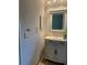 This bathroom offers updated features, including a plant and new fixtures at 48 Dade Ave, Sarasota, FL 34232