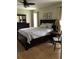 Comfortable bedroom with a dark wood bed frame, matching furniture, and neutral decor at 48 Dade Ave, Sarasota, FL 34232