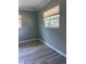 Empty bedroom showcasing neutral-toned walls, modern trim and new gray laminate flooring at 48 Dade Ave, Sarasota, FL 34232