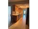 A traditional kitchen with stainless steel appliances, tile flooring and light wood cabinetry at 48 Dade Ave, Sarasota, FL 34232