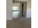Spacious living area with tiled flooring, showcasing the transition between rooms at 48 Dade Ave, Sarasota, FL 34232