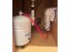 A water filtration system including a tank and filter, beneath a sink at 48 Dade Ave, Sarasota, FL 34232