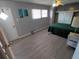 Bedroom features neutral paint, ceiling fan, and ample natural light at 5118 Oakland Hills Ave, Sarasota, FL 34234