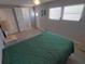 Bedroom with neutral paint and ample natural light at 5118 Oakland Hills Ave, Sarasota, FL 34234