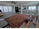 Open-concept living room with a kitchen and dining area and vinyl floors at 5118 Oakland Hills Ave, Sarasota, FL 34234