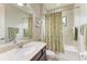 Clean bathroom featuring a bathtub, shower, and a large vanity with a sink at 518 Chantilly Trl, Bradenton, FL 34212