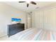 Cozy bedroom featuring a ceiling fan, and a large closet at 518 Chantilly Trl, Bradenton, FL 34212