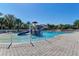 Large community pool with splash pad and slide offering hours of fun for the whole Gathering at 518 Chantilly Trl, Bradenton, FL 34212