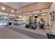 Well-equipped fitness center with treadmills, elliptical machines, and weight training equipment overlooking the community pool at 518 Chantilly Trl, Bradenton, FL 34212