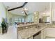 Open kitchen and living room layout featuring granite countertops at 518 Chantilly Trl, Bradenton, FL 34212