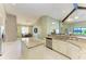 Open floorplan showcasing kitchen island, dining area, and living room at 518 Chantilly Trl, Bradenton, FL 34212