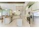 Bright kitchen with granite countertops, stainless steel appliances, and ample cabinet space at 518 Chantilly Trl, Bradenton, FL 34212