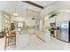 Gourmet kitchen boasts granite counters, white cabinets, and stainless steel appliances at 518 Chantilly Trl, Bradenton, FL 34212