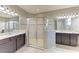 The main bathroom has double sinks, a glass-enclosed shower, and ample counter space at 518 Chantilly Trl, Bradenton, FL 34212