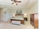Spacious bedroom features a tray ceiling, ceiling fan, and a king-sized bed at 518 Chantilly Trl, Bradenton, FL 34212