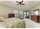 Relaxing main bedroom with ample natural light and a view of the pool area at 518 Chantilly Trl, Bradenton, FL 34212