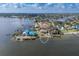 Waterfront home featuring private docks, green surroundings, and calming bay views at 5912 Riverview Ln, Bradenton, FL 34209