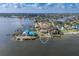 Stunning aerial view of waterfront property with lush landscaping and private dock at 5912 Riverview Ln, Bradenton, FL 34209