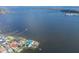 Scenic aerial view featuring waterfront home with private docks, and calming bay waters at 5912 Riverview Ln, Bradenton, FL 34209