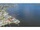 Expansive aerial shot of waterfront home with private docks surrounded by picturesque bay and neighborhood at 5912 Riverview Ln, Bradenton, FL 34209