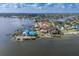Aerial view of waterfront homes, showcasing the surrounding neighborhood and access to the ocean at 5912 Riverview Ln, Bradenton, FL 34209