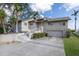 Beautifully maintained home with lush lawn, two-car garage, and inviting front entrance at 5912 Riverview Ln, Bradenton, FL 34209