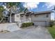 Inviting two-story home with a well-manicured lawn and attached two-car garage at 5912 Riverview Ln, Bradenton, FL 34209