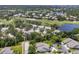 A scenic view featuring the community and its proximity to a golf course and water features at 6222 Country Club Way, Sarasota, FL 34243