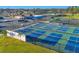 Aerial view of the tennis and pickleball courts at Palm Aire at 6222 Country Club Way, Sarasota, FL 34243