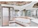 Bright bathroom features a soaking tub and a glass enclosed shower at 6222 Country Club Way, Sarasota, FL 34243