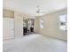 Spacious bedroom with neutral carpet, natural light, and outdoor access at 6222 Country Club Way, Sarasota, FL 34243