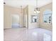 Open living room with plenty of natural light and tile floors at 6222 Country Club Way, Sarasota, FL 34243