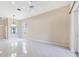 Spacious living room with tile floors, modern ceiling fan, and open floor plan at 6222 Country Club Way, Sarasota, FL 34243