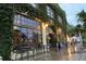 Charming restaurant exterior with ivy-covered facade and outdoor seating near the entrance at 655 Maldives Trl, Sarasota, FL 34234