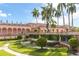 Elegant exterior view of the museum grounds featuring statues, lush greenery, and a fountain at 655 Maldives Trl, Sarasota, FL 34234