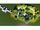 Overhead view of tree covered island featuring a walking path, dock, and gazebo at 6552 Moorings Point Cir # 201, Lakewood Ranch, FL 34202