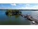 Aerial view of a pier, gazebo, and island on a lake on a sunny day at 6552 Moorings Point Cir # 201, Lakewood Ranch, FL 34202