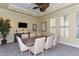 Well appointed conference room with large table, chairs, and TV for meetings at 6552 Moorings Point Cir # 201, Lakewood Ranch, FL 34202
